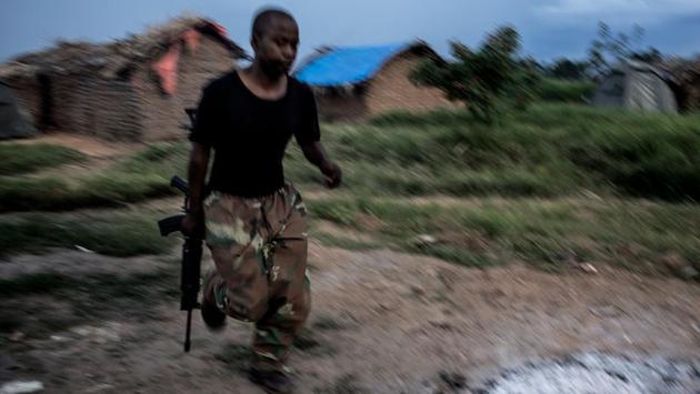 The next day, gunshots rang out again -- this time close to their base. The soldiers scrambled to put on their gear, but the jungle quietened down once their attention was turned to it. Over three days hunting the ADF, some of the mystery surrounding them dissipated. (John Wessels / AFP)
