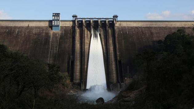 A view of Cheruthoni dam with one open gate in Idukki, Kerala. More than 5 million people in Kerala were affected and over 200 killed in torrential rain and floods in August. The flooding, dubbed the worst to hit the state in nearly a century, caused massive damage. As rain intensified, authorities were forced to release water from 35 dams to manage rising levels in reservoirs, many of which are used to generate electricity. (Sivaram V / REUTERS)