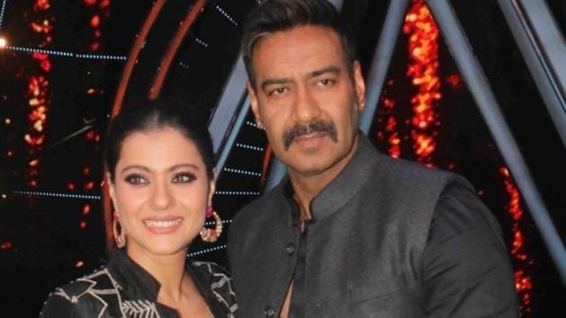 Actor Ajay Devgn along with his wife Kajol on the sets of singing reality show Indian Idol 10 in Mumbai.(IANS)