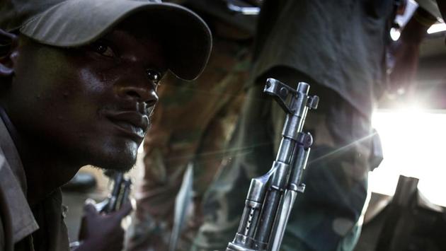 One Saturday, the troops headed to the scene of a particularly violent ADF onslaught a few days earlier. Members of the militia were said to have used two women as human shields during a shootout with Congolese troops that lasted four hours. Both women were killed. Everything seemed quiet when the troops arrived, except for the sporadic sound of gunfire. (John Wessels / AFP)