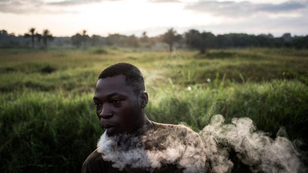 A Congolese soldier has an early morning smoke at their military base. Here in the Congo, ADF found a lucrative niche in the vast central African country’s lawless, resource-rich east. For Maijeke, the most important thing is ending the violence. “There has to be a dialogue between the FARDC (Congolese army) and the ADF,” he said. (John Wessels / AFP)