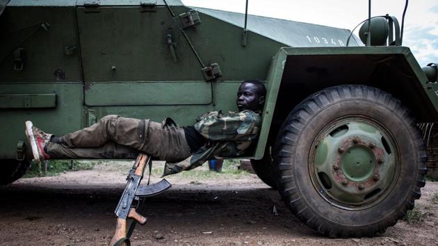 A soldier from the Armed Forces of the Democratic republic of the Congo (FARDC) is seen at their military base outside Oicha. (John Wessels / AFP)