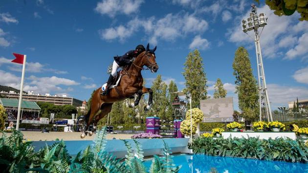 France’s horseman Kevin Staut steers his horse For Joy Van’t Zorgvliet HDC as they compete in the Longines FEI Jumping Nations Cup Final at the Olympic arena of the Real Club de Polo of Barcelona, Spain. (Josep Lago / AFP)