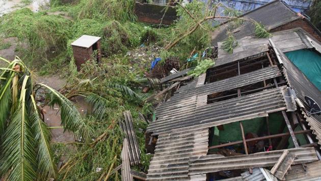 Damaged houses at a village along the Odisha-Andhra Pradesh border after cyclone Titli passed through.(Arabinda Mahapatra/HT Photo)