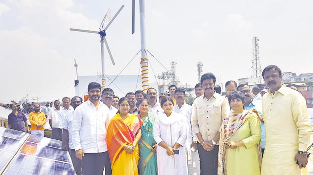 Wind and solar hybrid energy project set up at PMPML Swargate depot in the presence of MP Anil Shirole (third from right), Nayana Gunde (second from right ) and others. (HT PHOTO) Wind and solar hybrid energy project set up at PMPML Swargate depot in the presence of MP Anil Shirole (third from right), Nayana Gunde (second from right ) and others. (HT PHOTO)