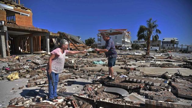 A couple trying to recover belongings from the place where their house was in Mexico Beach, Florida, in the aftermath of Hurricane Michael on October 12, 2018. (AFP Photo) A couple trying to recover belongings from the place where their house was in Mexico Beach, Florida, in the aftermath of Hurricane Michael on October 12, 2018. (AFP Photo)