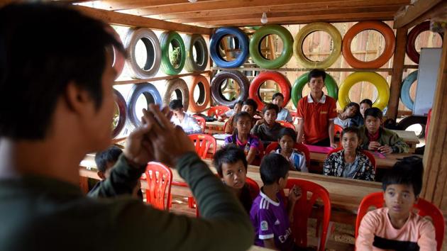 “I use rubbish to educate children by turning garbage into classrooms... so the children will understand the value of using rubbish in a useful way,” the 34-year-old said at the school, which opened a year and a half ago. He plans to expand classes in the province to accommodate 200 kids, with a new kindergarten class featuring a wall made from plastic bottles set to open next year. (Tang Chhin Sothy / AFP)