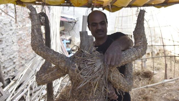 Mondol has been making idols for the last 13 years. While Gurugram has many Durga Puja pandals that bring home idols of Durga, Lakshmi, Saraswati and Kartik from Delhi during the festival, few know of this shy, self-taught resident who has been making idols, bedecking them in fineries and jewellery and ensuring that every expression and every feature of the beloved Goddess is done right. (Sanjeev Verma / HT Photo) 