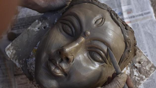 He adds that a part of the soil that is used to make idol must be from the backyard of a prostitute’s house. The commissioners of the idols bring this ‘mati’ for him, he says. All of Mondol’s idols are eco-friendly as he only uses clay. He says that when these idols will be immersed, the clay will dissolve in the water in an hour, as there is no POP used. (Sanjeev Verma / HT Photo) 