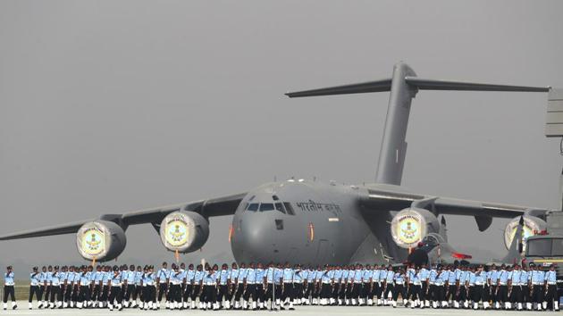 Indian Air Force soldiers march past a C-17 Globemaster military transport aircraft during the Indian Air Force day parade at Hindon air base on the outskirts of New Delhi. (Manish Swarup / AP)