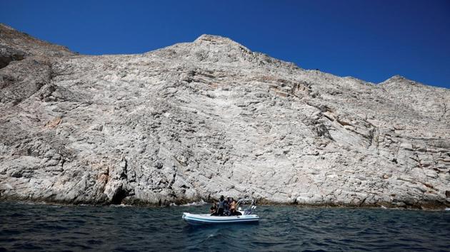 Members of the Fournoi Survey Project are seen on an inflatable boat before a dive. Experts say they weave an exciting tale of how ships full of cargo travelling through the Aegean, the Mediterranean and the Black Sea met their fate in sudden storms and surrounded by rocky cliffs in the area. (Alkis Konstantinidis / REUTERS) Members of the Fournoi Survey Project are seen on an inflatable boat before a dive. Experts say they weave an exciting tale of how ships full of cargo travelling through the Aegean, the Mediterranean and the Black Sea met their fate in sudden storms and surrounded by rocky cliffs in the area. (Alkis Konstantinidis / REUTERS)