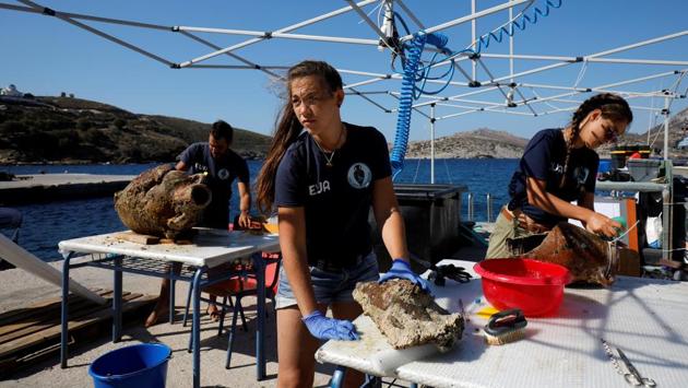 Students Giorgos Agavanakis, 24, Helen Margarita Bardas, 25, and Eirini Mitsi, 23, work on amphorae. Particularly exciting were amphorae found originating from the Black Sea and north Africa in shipwrecks from the late Roman period, as it is rare to find cargo from these regions intact in shipwrecks in the Aegean, said Koutsouflakis. (Alkis Konstantinidis / REUTERS) Students Giorgos Agavanakis, 24, Helen Margarita Bardas, 25, and Eirini Mitsi, 23, work on amphorae. Particularly exciting were amphorae found originating from the Black Sea and north Africa in shipwrecks from the late Roman period, as it is rare to find cargo from these regions intact in shipwrecks in the Aegean, said Koutsouflakis. (Alkis Konstantinidis / REUTERS)