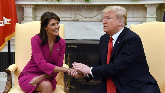 US President Donald Trump shakes hands with Nikki Haley, the United States Ambassador to the United Nations in the Oval office of the White House. Nikki Haley resigned Tuesday, in the latest departure from President Trump’s national security team. (Olivier Douliery / AFP)