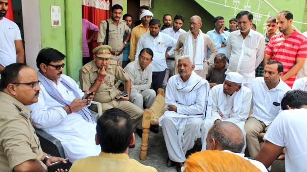 Family mourns after a couple was stabbed to death in Jamalpur village of Greater Noida. (HT Photo) Family mourns after a couple was stabbed to death in Jamalpur village of Greater Noida. (HT Photo)