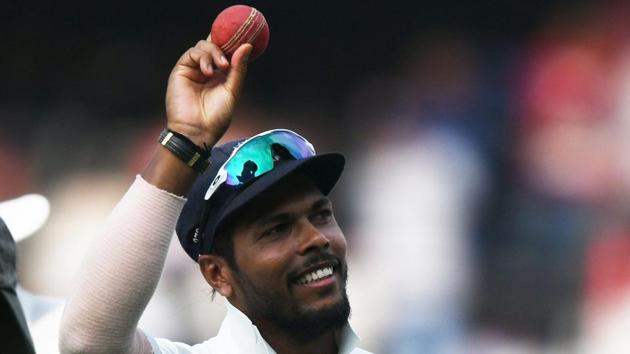 Indian Bowler Umesh Yadav shows the ball for the ten (10) wickets haul in the match during the third day's play of the second Test cricket match between India and West Indies at the Rajiv Gandhi International Cricket Stadium in Hyderabad.(AFP)