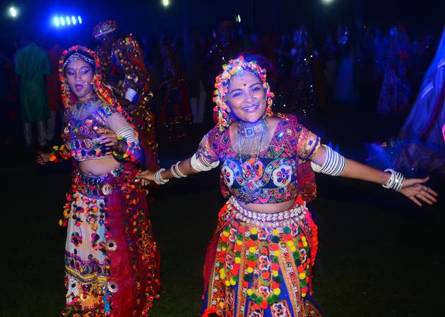 Pune, India - Oct. 13, 2018:People participate in a Dandia dance during Navrathri celebrations at Raga Lawns, Koregaun Park in Pune, India, on Saturday, October 13, 2018. (Photo by Shankar Narayan/HT PHOTO)