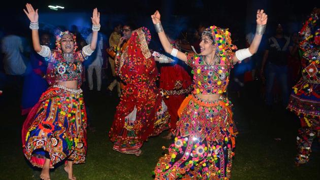 The Dandiya Raas dance originated as devotional Garba dances, were performed in honor of Goddess Durga. (SHANKAR NARAYAN/HT PHOTO)