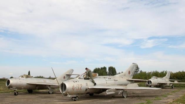 An Albanian Air Force crew member inspects a MiG-19 jet fighter. NATO will spend over 50 million euros ($58 million) on the first stage of work to turn Kucova into a support base for supplies, logistics, training and drills, Xhacka said. (Florion Goga / REUTERS) An Albanian Air Force crew member inspects a MiG-19 jet fighter. NATO will spend over 50 million euros ($58 million) on the first stage of work to turn Kucova into a support base for supplies, logistics, training and drills, Xhacka said. (Florion Goga / REUTERS)