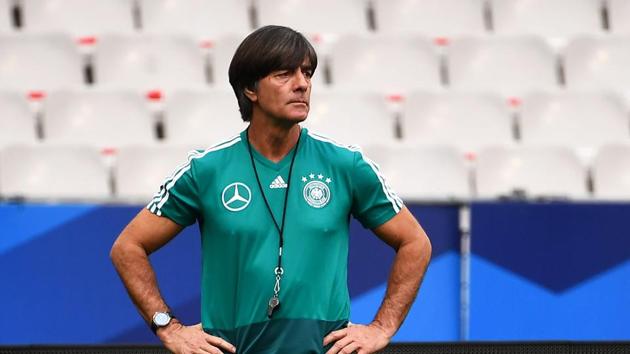 Germany's coach Joachim Loew looks at his players during a training session at the Stade de France stadium in Saint-Denis.(AFP)