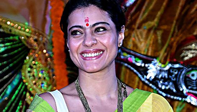 Kajol poses for a picture during the Maha Panchami Puja and Murti Sthapna at North Bombay Sarbojanik Durga Puja, in Mumbai.(AFP)