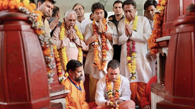 Congress President Rahul Gandhi along with state Congress president Kamal Nath and senior party leader Jyotiraditya Scindia offers prayers at Pitambara Peeth in Datia. During his two-day tour of poll-bound Madhya Pradesh, Gandhi will also be addressing a public meeting in Datia later in the day today. (PTI)