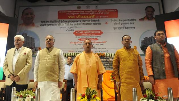 CM Yogi Adityanath(centre), health education minister Ashtosh Tandon(2nd from left) and PGI director Rakesh Kapoor(extreme left) during the foundation stone laying ceremony at SGPGI. (Deepak Gupta/HT Photo) CM Yogi Adityanath(centre), health education minister Ashtosh Tandon(2nd from left) and PGI director Rakesh Kapoor(extreme left) during the foundation stone laying ceremony at SGPGI. (Deepak Gupta/HT Photo)