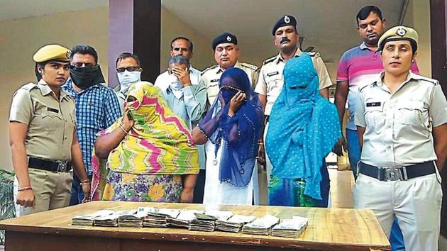 The accused in police custody in Karnal on Monday. The complainant had also provided video clips of the accused taking money from him.(HT Photo)