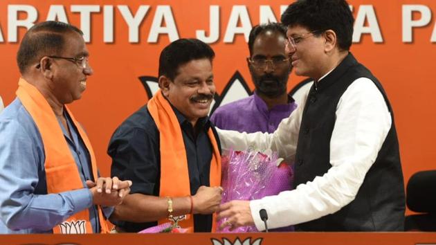 Two Goa Congress MLA - Subhash Shirodkar (left ) and Dayanad Sobte (centre) joined the BJP in presence of union minister Piyush Goyal at the BJP headquarter in New Delhi on Tuesday(HT photo: Mohd Zakir)