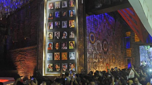 In Kalighat, the Badamtala Ashar Sangha Durga Puja is themed on ‘Sab charitra Kalponic’ (All characters are fictional), celebrating womanhood. The pandal is a crowd-puller, decorated with sketches of iconic women from across India by the artist Parimal Paul. (Samir Jana / HT Photo) In Kalighat, the Badamtala Ashar Sangha Durga Puja is themed on ‘Sab charitra Kalponic’ (All characters are fictional), celebrating womanhood. The pandal is a crowd-puller, decorated with sketches of iconic women from across India by the artist Parimal Paul. (Samir Jana / HT Photo)