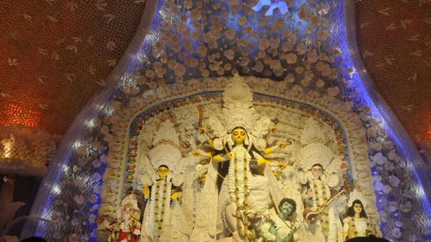 The Ballygunge Cultural Association Durga Puja is themed on the marriage of Lord Mahadev and Parvati, the whole pandal being created with Shola, a kind of papier–mâché made from the shola plant. It took artist Biman Saha and 40 other artists and 200 assistants around 240 days in its preparation. (Samir Jana / HT Photo) The Ballygunge Cultural Association Durga Puja is themed on the marriage of Lord Mahadev and Parvati, the whole pandal being created with Shola, a kind of papier–mâché made from the shola plant. It took artist Biman Saha and 40 other artists and 200 assistants around 240 days in its preparation. (Samir Jana / HT Photo)