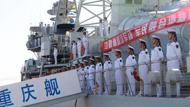 Chinese People's Liberation Army (PLA) navy soldiers stand on a decommissioned destroyer in an aircraft carrier theme park during a celebration event on China's Navy Day at Binhai New Area, Tianjin, China, in April 2017. (Reuters File Photo) Chinese People's Liberation Army (PLA) navy soldiers stand on a decommissioned destroyer in an aircraft carrier theme park during a celebration event on China's Navy Day at Binhai New Area, Tianjin, China, in April 2017. (Reuters File Photo)