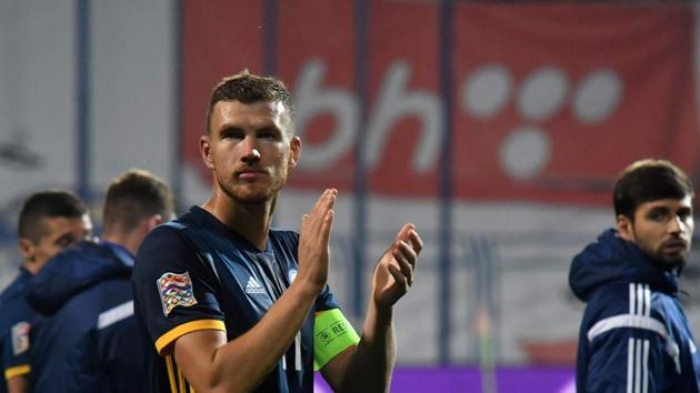 Bosnia and Herzegovina's captain Edin Dzeko thanks the fans for the support after the game against Northern Ireland.(AFP)