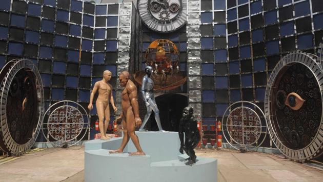 This year’s theme at the Jagat Mukherjee Park Durga Puja is ‘Time Machine’ depicting human evolution with installations of giant clocks by Subal Paul which move 200 years forward or backwards. (Samir Jana / HT Photo) This year’s theme at the Jagat Mukherjee Park Durga Puja is ‘Time Machine’ depicting human evolution with installations of giant clocks by Subal Paul which move 200 years forward or backwards. (Samir Jana / HT Photo)