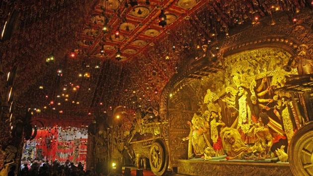 The 84th Durga Puja pandal of South Kolkata’s Mudiali Club Sarbojanin is themed on Bengal’s intricate and artistic folk art Dokar and Patachitra paintings. (Samir Jana / HT Photo) The 84th Durga Puja pandal of South Kolkata’s Mudiali Club Sarbojanin is themed on Bengal’s intricate and artistic folk art Dokar and Patachitra paintings. (Samir Jana / HT Photo)