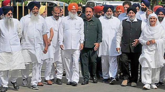 Shiromani Akali Dal leaders, led by party chief Sukhbir Singh Badal, coming out of the Punjab Raj Bhawan after submitting a memorandum to governor on Tuesday.(HT Photo)