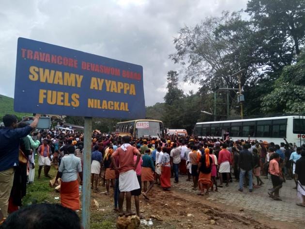Protestors block the road at Nilakkal base camp in Kerala. On Wednesday, at least three women journalists were attacked by an angry mob on their way to report the protests over the Supreme Court’s verdict to allow women of all ages into the Sabarimala temple dedicated to Lord Ayyappa. Also, a woman who was on her way to pray at the temple wearing jeans was stopped, reported IANS. (Vivek Nair / HT Photo)