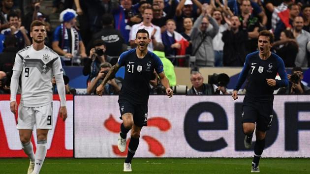 France's forward Antoine Griezmann (R) celebrates after scoring during the UEFA Nations League football match between France and Germany at the Stade de France in Saint-Denis, near Paris )(AFP)