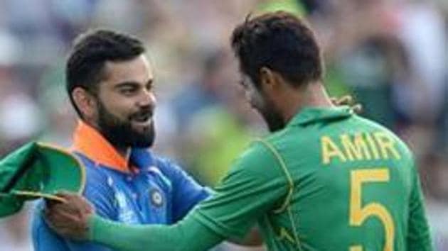 Mohammad Amir of Pakistan shakes hands with Virat Kohli of India after the ICC Champions Trophy final match between India and Pakistan.(Getty Images)