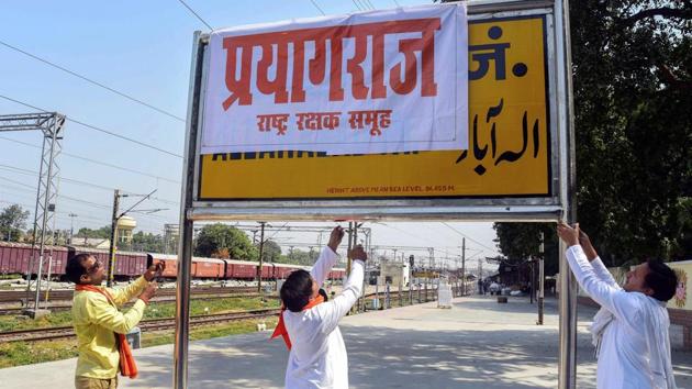 Rashtriya Rakshak Samuh activists cover Allahabad Railway Junction board with poster of 'Prayagraj' after the Uttar Pradesh government Cabinet approved renaming the city 'Allahabad' to 'Prayagraj' ahead of Kumbh Mela. (PTI)