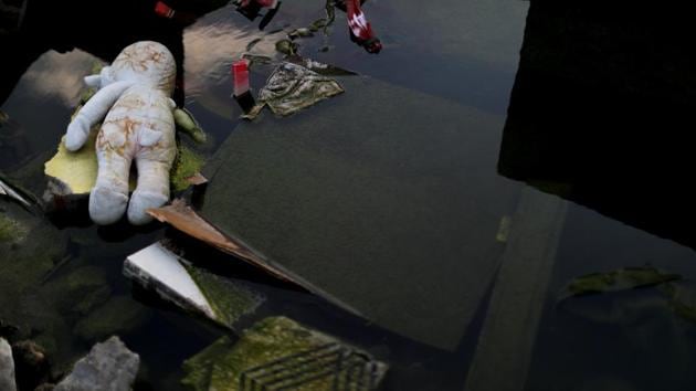 He stared quietly at the rubble in Balaroa, saying it concealed the body of his one-year-old daughter, missing after the September 28 disaster. “I’m just waiting here and hope that I can find my child,” he said. Four days after the quake, rescue workers found the remains of his wife, Hastuti, still holding in her arms the bodies of their other two daughters, aged four and two. (Jorge Silva / REUTERS)