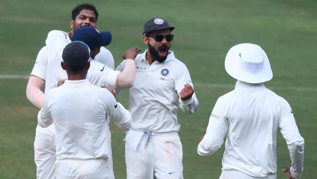 Indian captain Virat Kohli (C) and bowler Umesh Yadav (L) celebrates with teammates the dismissal of West Indian cricketer Roston Chase (L) during the third day's play of the second Test cricket match between India and West Indies at the Rajiv Gandhi International Cricket Stadium (AFP) Indian captain Virat Kohli (C) and bowler Umesh Yadav (L) celebrates with teammates the dismissal of West Indian cricketer Roston Chase (L) during the third day's play of the second Test cricket match between India and West Indies at the Rajiv Gandhi International Cricket Stadium (AFP)