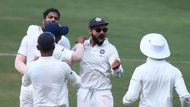 Indian captain Virat Kohli (C) and bowler Umesh Yadav (L) celebrates with teammates the fall of a wicket. (AFP) Indian captain Virat Kohli (C) and bowler Umesh Yadav (L) celebrates with teammates the fall of a wicket. (AFP)