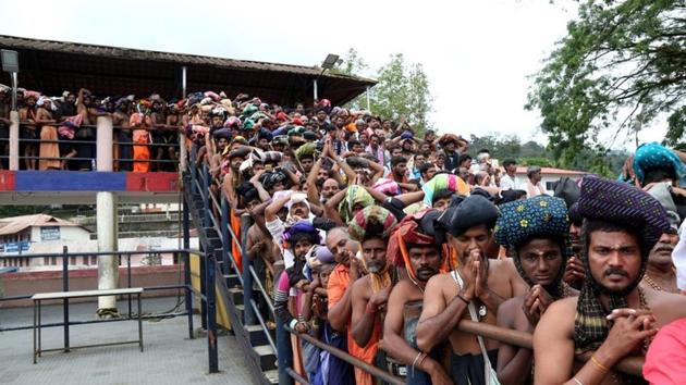 Hindu devotees wait in queues inside the premises of the Sabarimala temple in Pathanamthitta district in Kerala. (Reuters Photo) Hindu devotees wait in queues inside the premises of the Sabarimala temple in Pathanamthitta district in Kerala. (Reuters Photo)