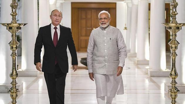 Prime Minister Narendra Modi and Russian President Vladimir Putin before their meeting in New Delhi on October 4.(PTI Photo)