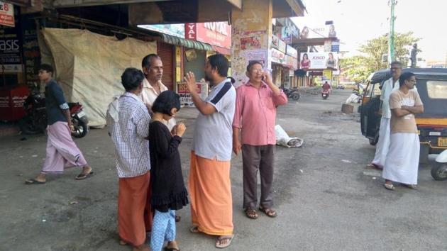 People stand around closed shops due to the 24-hour bandh at Pathanamthitta district in Kerala, on October 18, 2018. (HT Photo) People stand around closed shops due to the 24-hour bandh at Pathanamthitta district in Kerala, on October 18, 2018. (HT Photo)