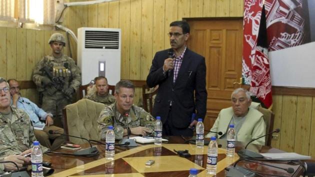 The head of NATO troops in Afghanistan, Gen. Scott Miller, center left, Kandahar Gov. Zalmay Wesa, center right, and their delegations attend a security conference, in Kandahar, Afghanistan, Thursday, Oct. 18, 2018. (AP) The head of NATO troops in Afghanistan, Gen. Scott Miller, center left, Kandahar Gov. Zalmay Wesa, center right, and their delegations attend a security conference, in Kandahar, Afghanistan, Thursday, Oct. 18, 2018. (AP)