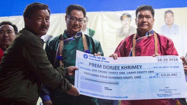 Prem Dorjee Khrimey (second from left) receiving a cheque from Arunachal Pradesh Chief Minister Pema Khandu (second from right) at an event held at Rupa in West Kameng district on Thursday. (HT Photo) Prem Dorjee Khrimey (second from left) receiving a cheque from Arunachal Pradesh Chief Minister Pema Khandu (second from right) at an event held at Rupa in West Kameng district on Thursday. (HT Photo)