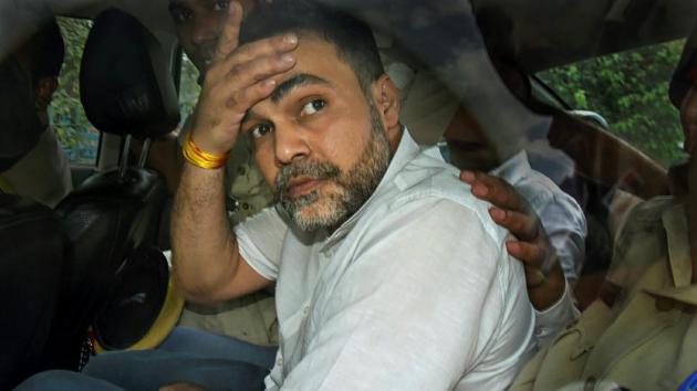 Ashish Pandey, accused of brandishing gun at guests outside a hotel, being brought out of the Patiala House Courts in New Delhi, Thursday, Oct 18, 2018.(PTI)