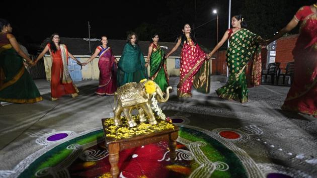 Women police personnel from various police stations participate in Bhondala (traditional dance form) organised at Khadak police station on the occasion of Navaratri on Tuesday. (Pratham Gokhale/HT Photo) Women police personnel from various police stations participate in Bhondala (traditional dance form) organised at Khadak police station on the occasion of Navaratri on Tuesday. (Pratham Gokhale/HT Photo)