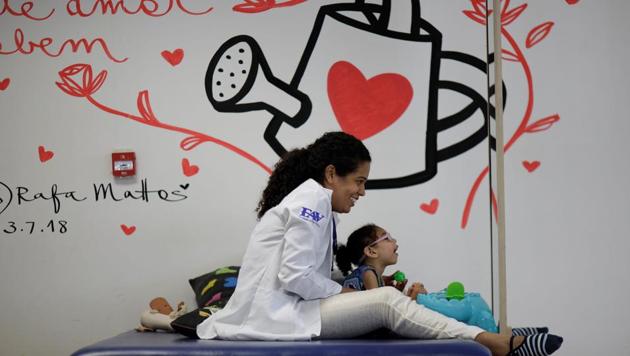 Luana Vieira, who is two years old, and was born with microcephaly, reacts to stimulus during an evaluation session at the Altino Ventura rehabilitation centre in Recife, Brazil. Luana’s mother Rosana Vieira Alves has three daughters. “It’s hard to manage the girls. Some of them are jealous, but Luana needs more care. In time, they’ll understand.” she said. Alves lacks family support and is overwhelmed by housing and medical costs. (Ueslei Marcelino / REUTERS)